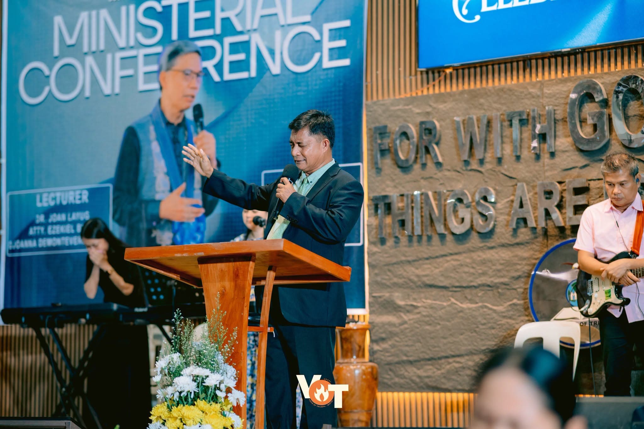 A pastor addressing attendees at a district ministerial conference